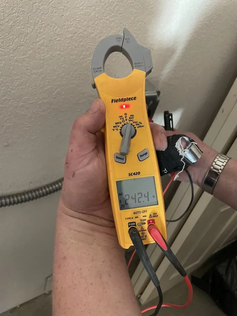 Voltage testing with clamp meter during Generator Installation in Granby